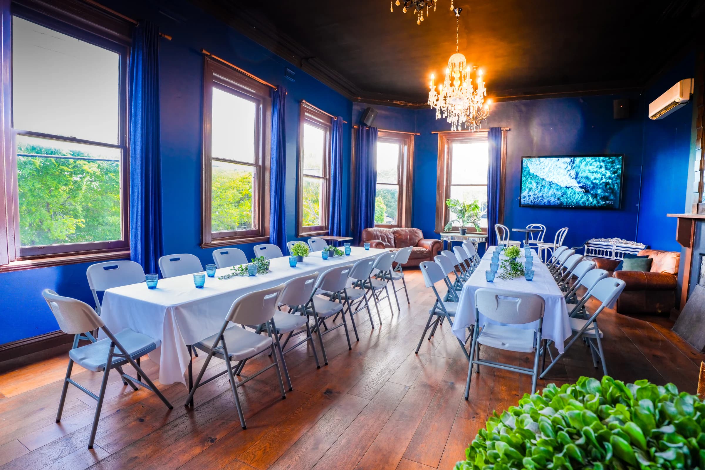 Function Room arranged with long dining tables at The Cornerstone Pub